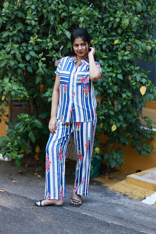 Neemai White and blue Bold striped co-ord set with vibrant abstract prints, front openable buttons and relaxed everyday comfort fit.