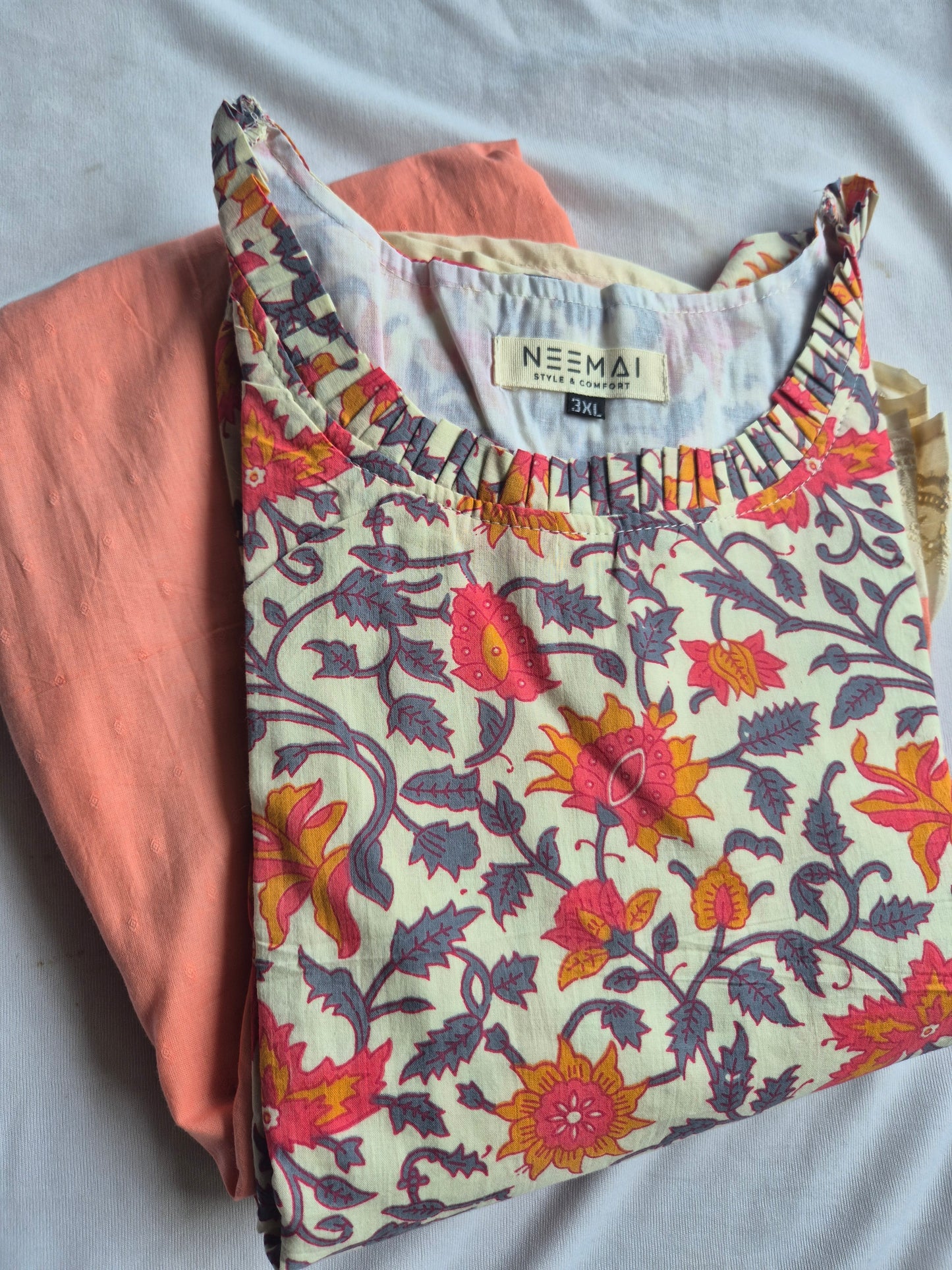 Neemai floral printed maternity wear dress with soft pastel tones, relaxed fit and all-day comfort styling.