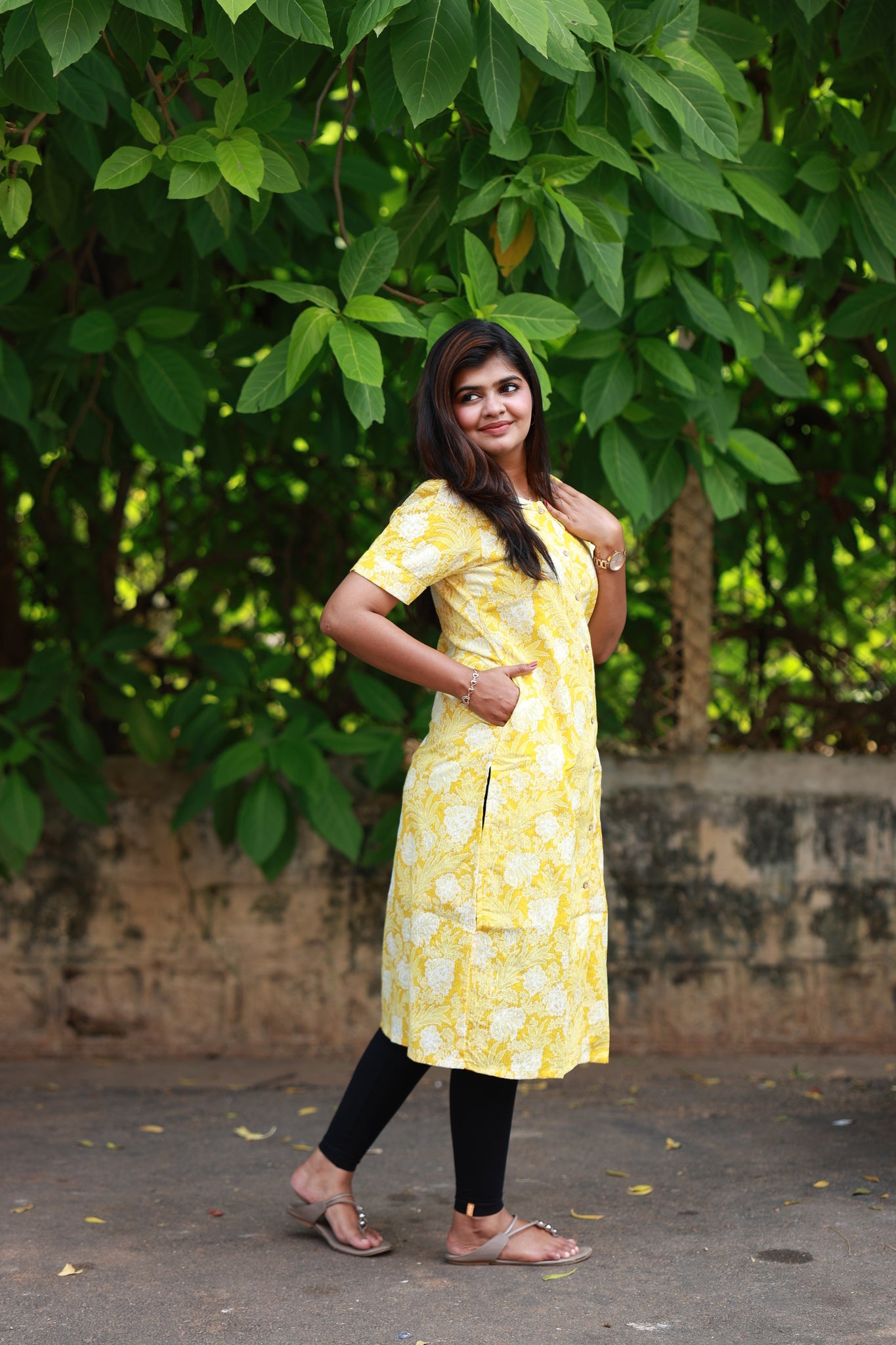 Lemon color flower print maternity kurti with Soft Peter Pan collar, front feeding buttons, short sleeves and side pockets for everyday Comfort.