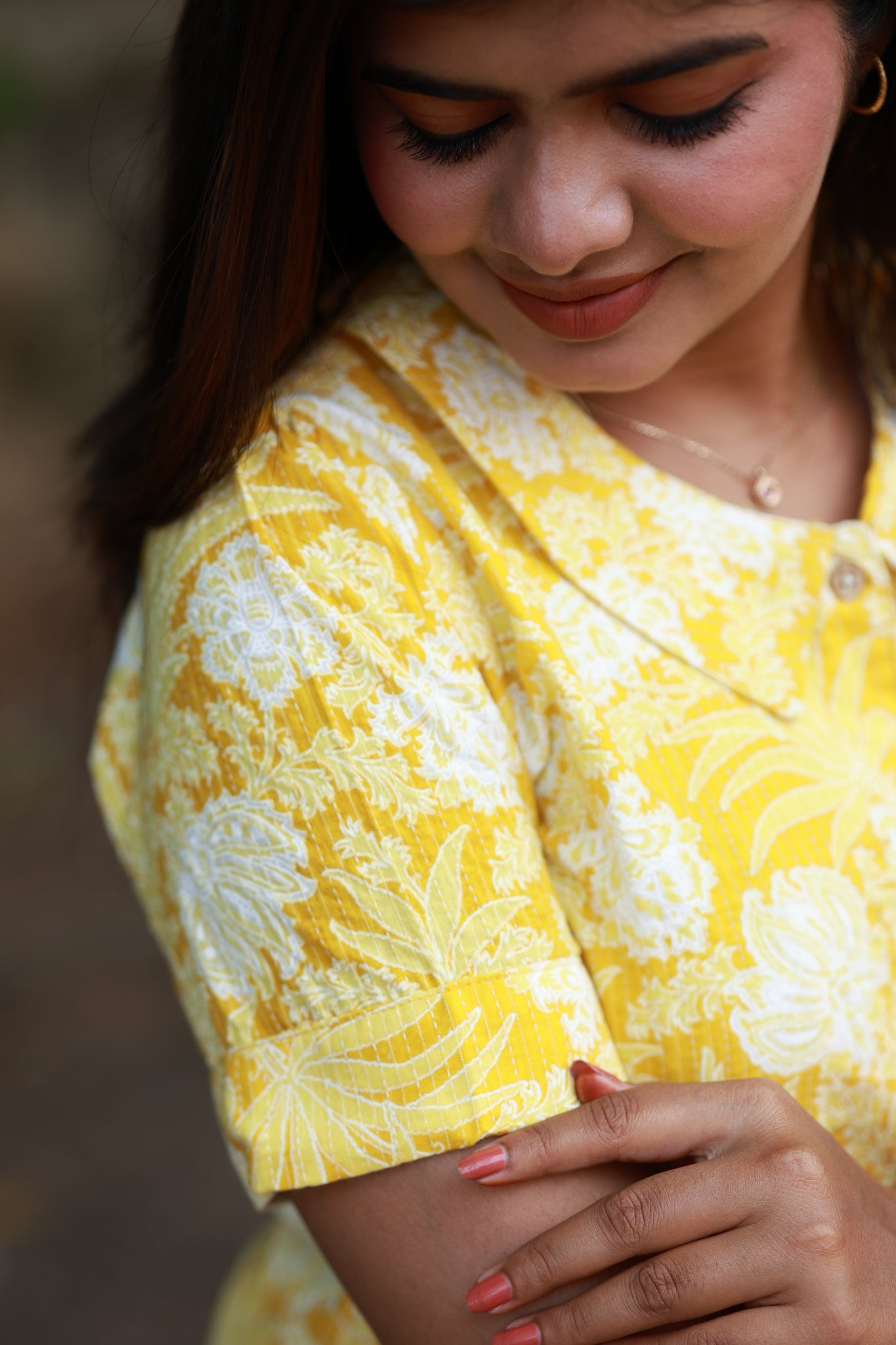 Lemon color flower print maternity kurti with short sleeves detailing.