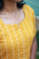 Maternity tops - 2 piece set [ kurta and pant ] - Yellow color. close-up showing soft breathable  ikkat fabric and feeding option. Easy front zip access for nursing mothers