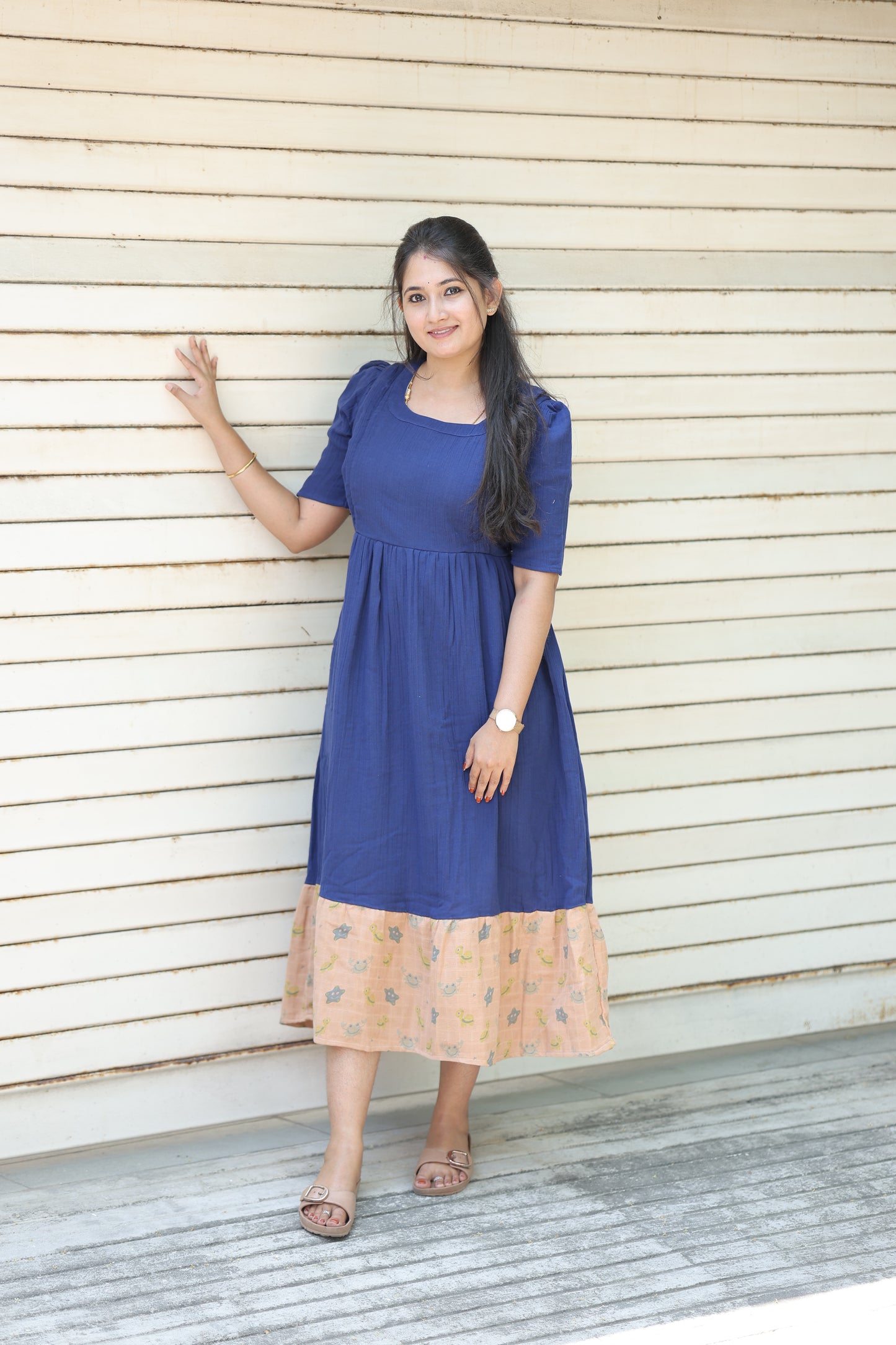 Neemai navy blue muslin cotton feeding maxi dress with elegant contrast floral border hem, breathable lightweight fabric and comfortable flowy maternity fit for daily wear.