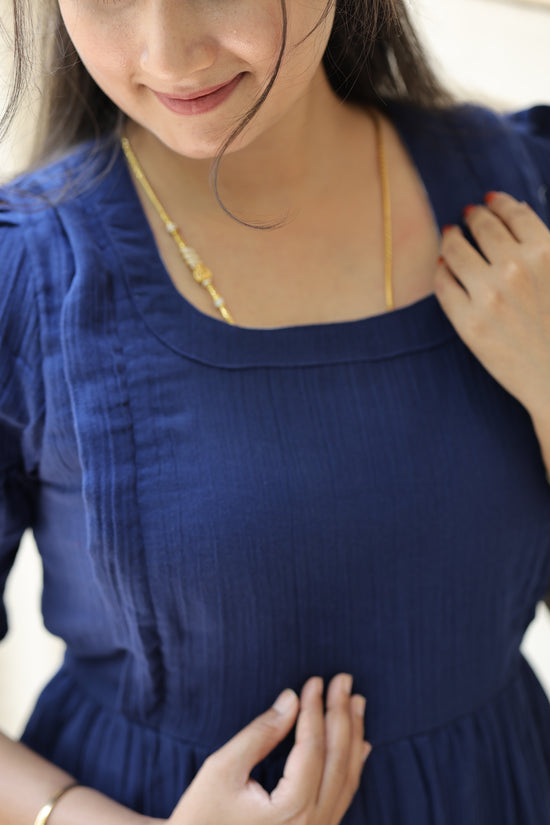 Neemai navy blue maternity and nursing dress with square neckline, soft textured muslin fabric and stylish summer friendly feeding wear, comfortable pregnancy outing outfit.