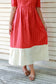 Flowy red ankle-length maternity dress with contrast white hemline, soft airy fabric and elegant casual look.