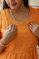 Neemai orange muslin cotton nursing dress with square neck design, soft airy fabric, comfortable summer wear for feeding moms and daily casual styling.