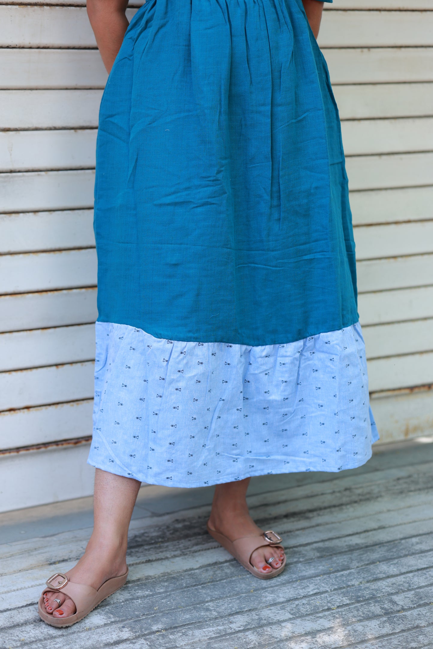 Neemai teal blue muslin maxi gown with contrast printed border hem, flowy silhouette and lightweight summer friendly maternity wear styling, plus size maternity wear 