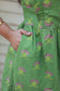 Light green printed maternity dress with functional side pockets, gathered bump friendly waist design and airy plus size maternity wear 