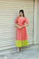 Neemai orange maternity maxi dress with contrast green hem, relaxed flowy fit, bump-friendly festive wear, lightweight summer outfit for moms-to-be, plus size festive wear 