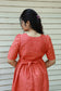 Neemai orange and green checkered maternity dress with adjustable back tie, flexible waist for growing bump, lightweight plus size friendly clothing