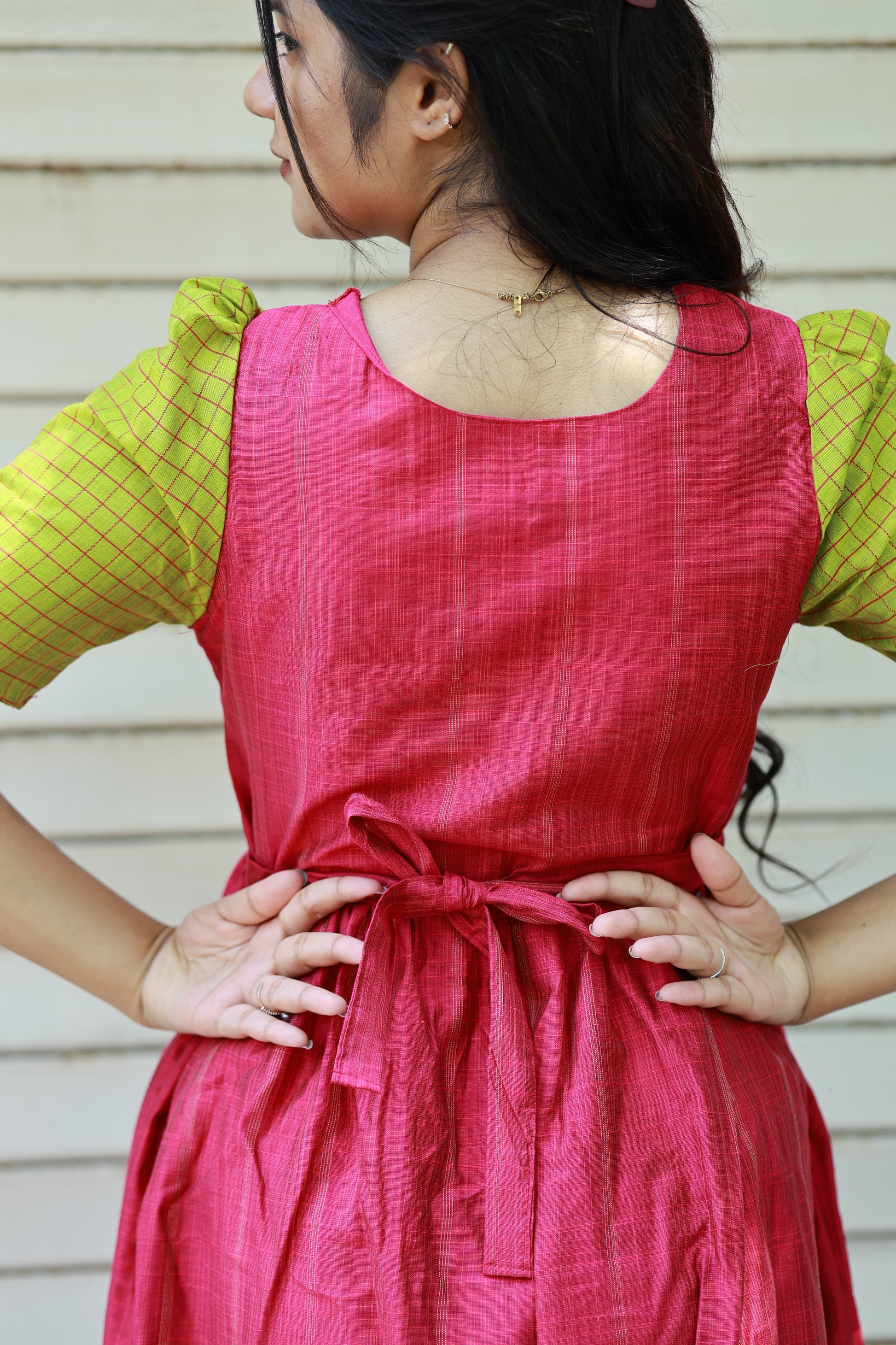 Neemai pink butter silk maternity gown with back tie knot detail, green checked puff sleeves, stylish everyday wear