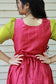 Neemai pink butter silk maternity gown with back tie knot detail, green checked puff sleeves, stylish everyday wear
