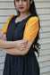 Neemai black butter silk maternity dress with yellow checked sleeves, stylish puff sleeve design, lightweight comfortable fabric, perfect summer friendly festive wear 