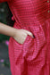 Neemai pink butter silk maternity dress with black checks and side pocket, lightweight smooth fabric, practical pregnancy wear, plus size festive collection 