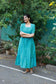 Neemai blue butter silk checkered maternity dress, bump-friendly flowy silhouette, breathable pregnancy wear, postpartum comfort outfit, soft lightweight ethnic maxi
