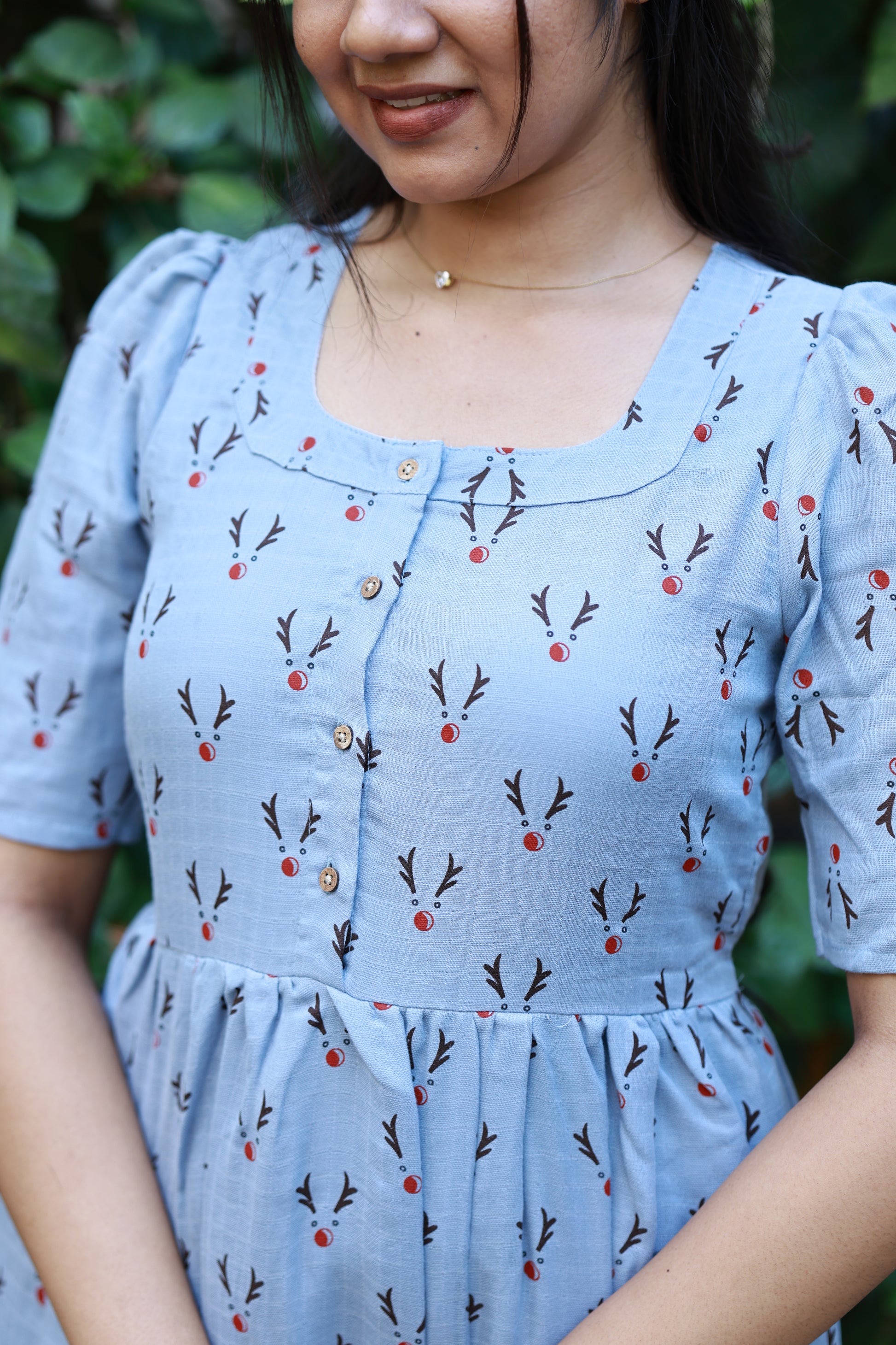 Neemai blue printed muslin feeding dress with front button nursing access, lightweight cotton fabric and elegant square neckline design.