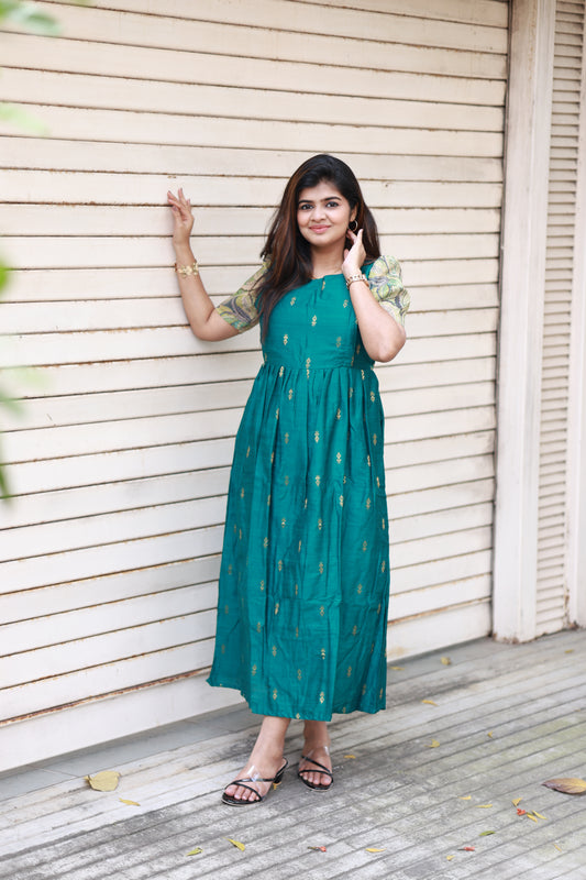 Neemai peacock Green Festive Maternity Maxi – graceful raw silk gown designed for pregnancy and postpartum, lightweight and comfortable silhouette for special occasions, plus size available