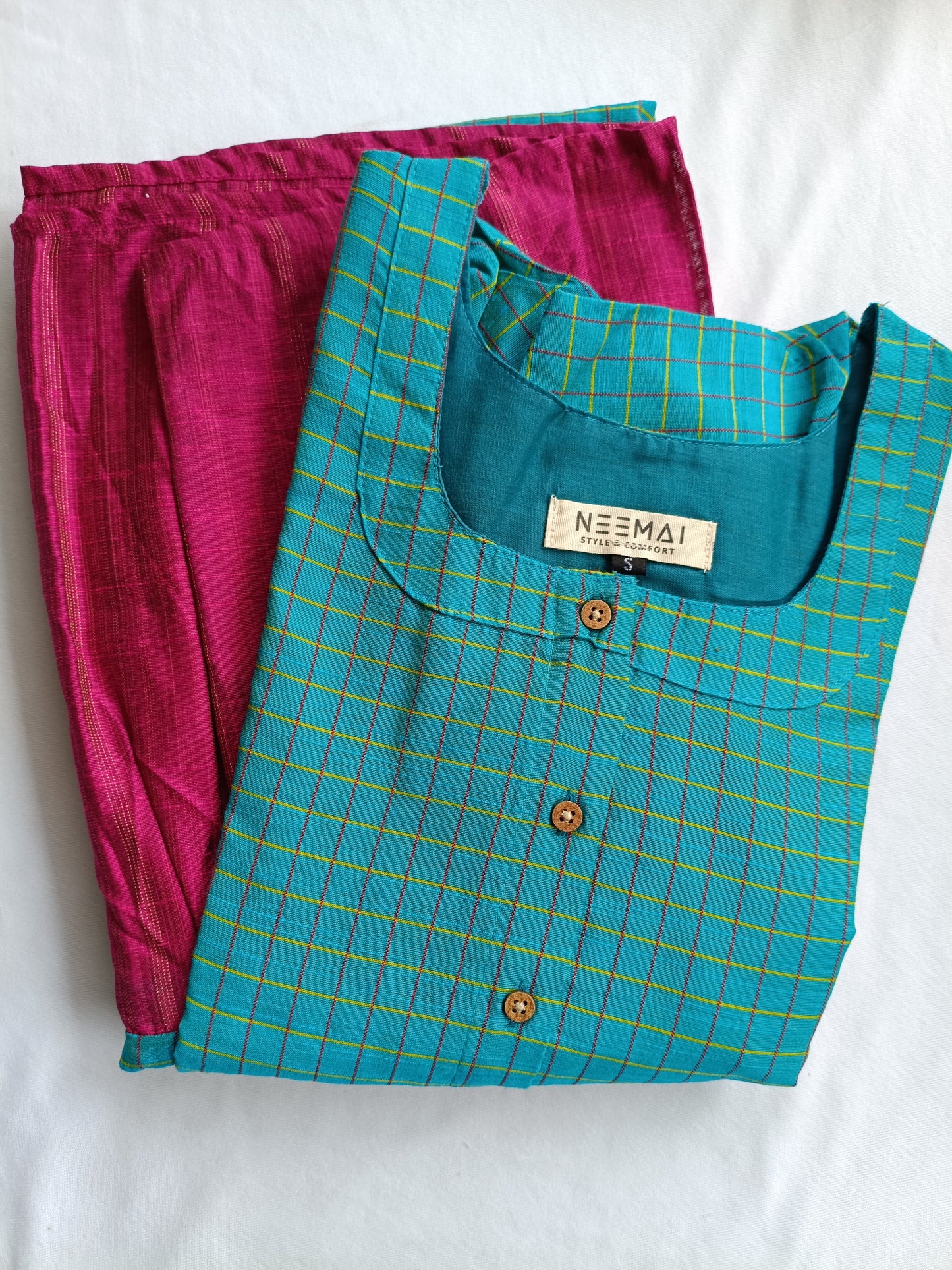 Neemai butter silk teal checkered maternity dress with front buttons, paired with contrast pink bottom, lightweight summer-friendly ethnic wear, plus size festive collection